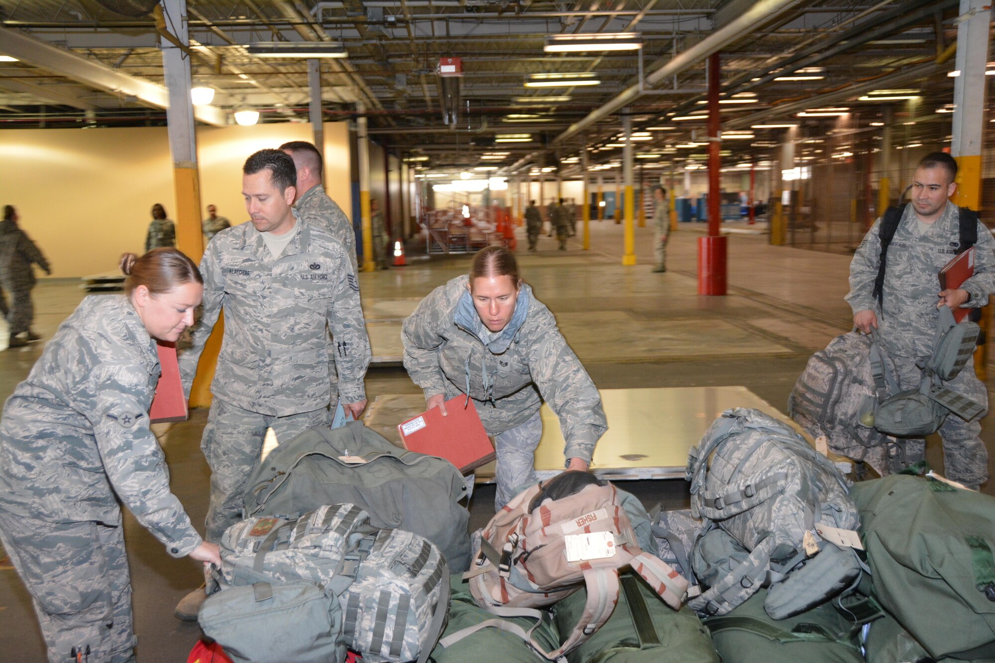 Citizen Airmen from Tinker Air Force Base practice pre-deployment processing through the Personnel Deployment Function line March 25, 2017, at Tinker Air Force Base, Okla. (U.S. Air Force photo/Senior Airman Callie McNary) 