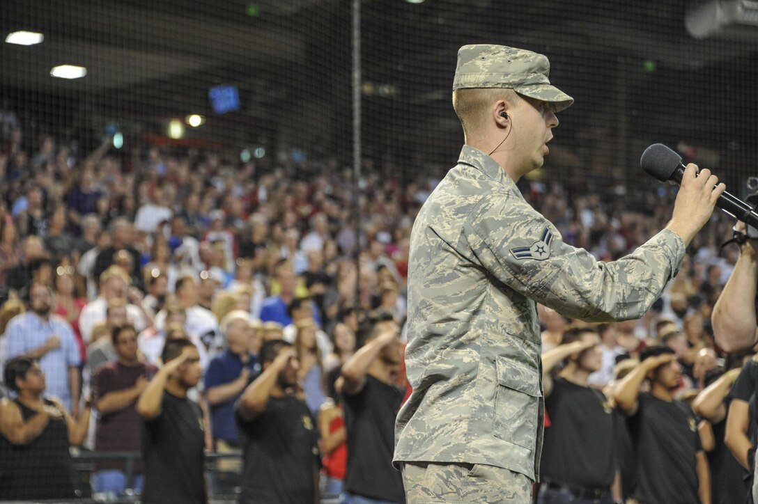 Airman 1st Class Timothy Orr, 944th Operations Group aviation resource manager, sings the national anthem before a Diamondbacks major league baseball game at Chase Field in Phoenix, Ariz., July 2, 2017. Orr performed the national anthem as part of a Diamondbacks Military Appreciation Day honoring all active duty, reserve, retired and veterans from the past, present and future. (U.S. Air Force photo by Airman 1st Class Caleb Worpel)