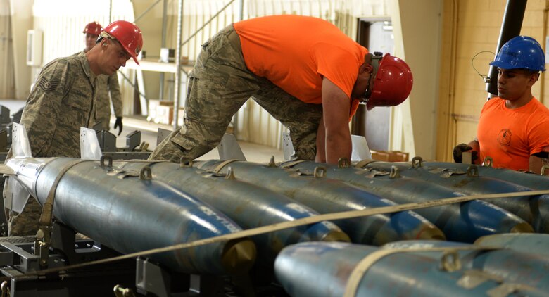 Senior Airman Joshua Blevins, a conventional maintenance crew member from the 28th Munitions Squadron, ensures a dummy ordinance is properly fastened down on a trailer so it can be towed away by a delivery truck on Ellsworth Air Force Base, S.D. June 26, 2017. Multiple bases from Air Force Global Strike Command participated in the annual AFGSC Challenge; which highlights bomber maintenance, munitions and intercontinental ballistic missile capabilities. (U.S. Air Force photo by Airman 1st Class Thomas Karol)