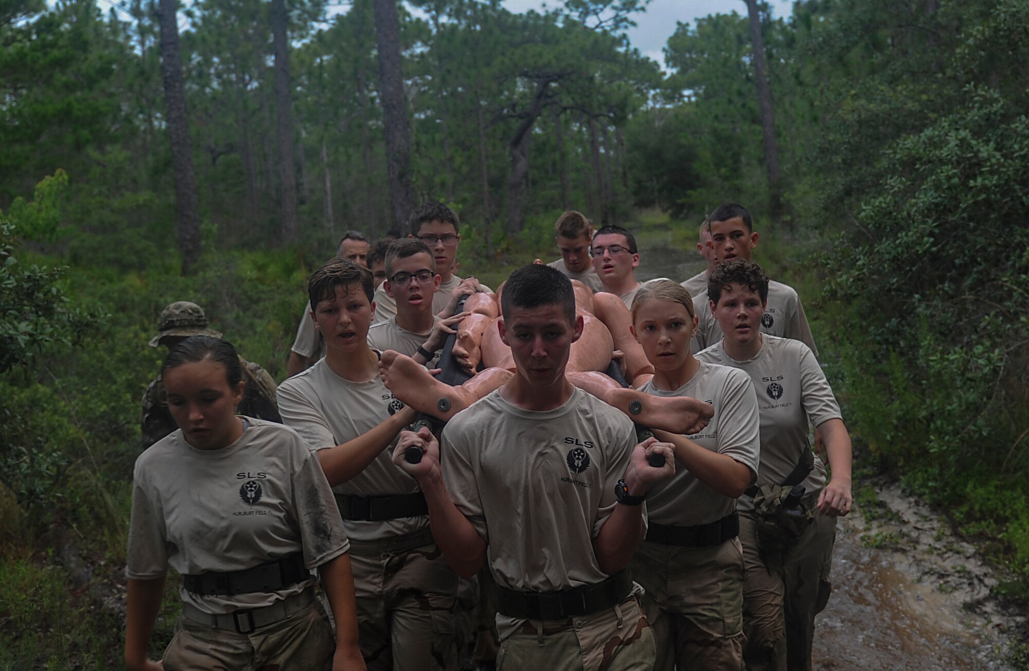 Junior ROTC cadets litter carry a simulated patient during a Monster Mash at Hurlburt Field, Fla., June 30, 2017. The JROTC Summer Leadership School brought more than 50 cadets to Hurlburt Field to engage in a variety of team-building and leadership skill-developing exercises under the guidance of Air Commandos, June 26 through 30. (U.S. Air Force photo by Airman 1st Class Rachel Yates)