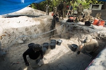 BETIO ISLAND, TARAWA ATOLL, KIRIBATI— Marines and Sailors with Task Force Koa Moana 17 transport dirt in order to assist an archaeological team at a World War II mass grave excavation, June 13, 2017, in Betio Island, Tarawa Atoll, Kiribati. The Marines and Sailors that assisted were unable to work with the fragile bones of the deceased, so they assisted with back-filling holes and transporting dirt.  No photos of the remains were taken in order to respect the deceased and their families. (U.S. Marine Corps photo by Sgt. Douglas D. Simons)