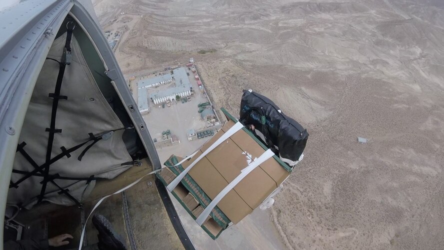 An Afghan air force C-208 crew, delivers supplies to Afghan National Defense Security Forces ground troops on June 28, 2017, in Afghanistan. This was the first operational airdrop performed by AAF aircrew. The AAF successfully delivered 800 pounds of supplies to Afghan Border Police at their coordinated drop zone. (U.S. Air Force photo by Tech. Sgt. Veronica Pierce)