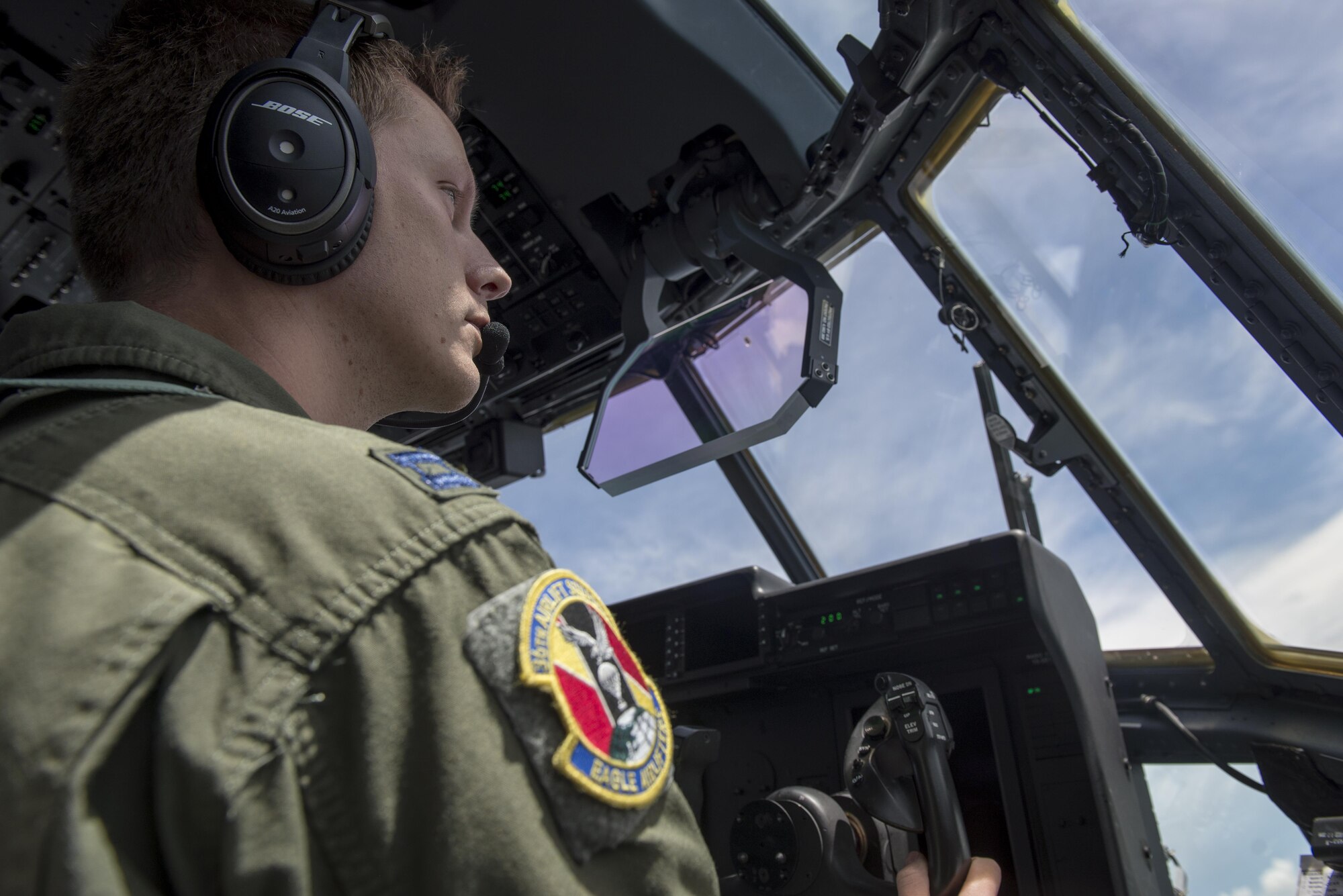A pilot assigned to the 36th Airlift Squadron flies Yokota Air Base’s first C-130J Super Hercules operational mission, June 30, 2017, near Manila, Philippines. The mission gave the Airmen the chance to showcase the aircraft’s capabilities while transporting cargo. (U.S. Air Force photo by Airman 1st Class Juan Torres)