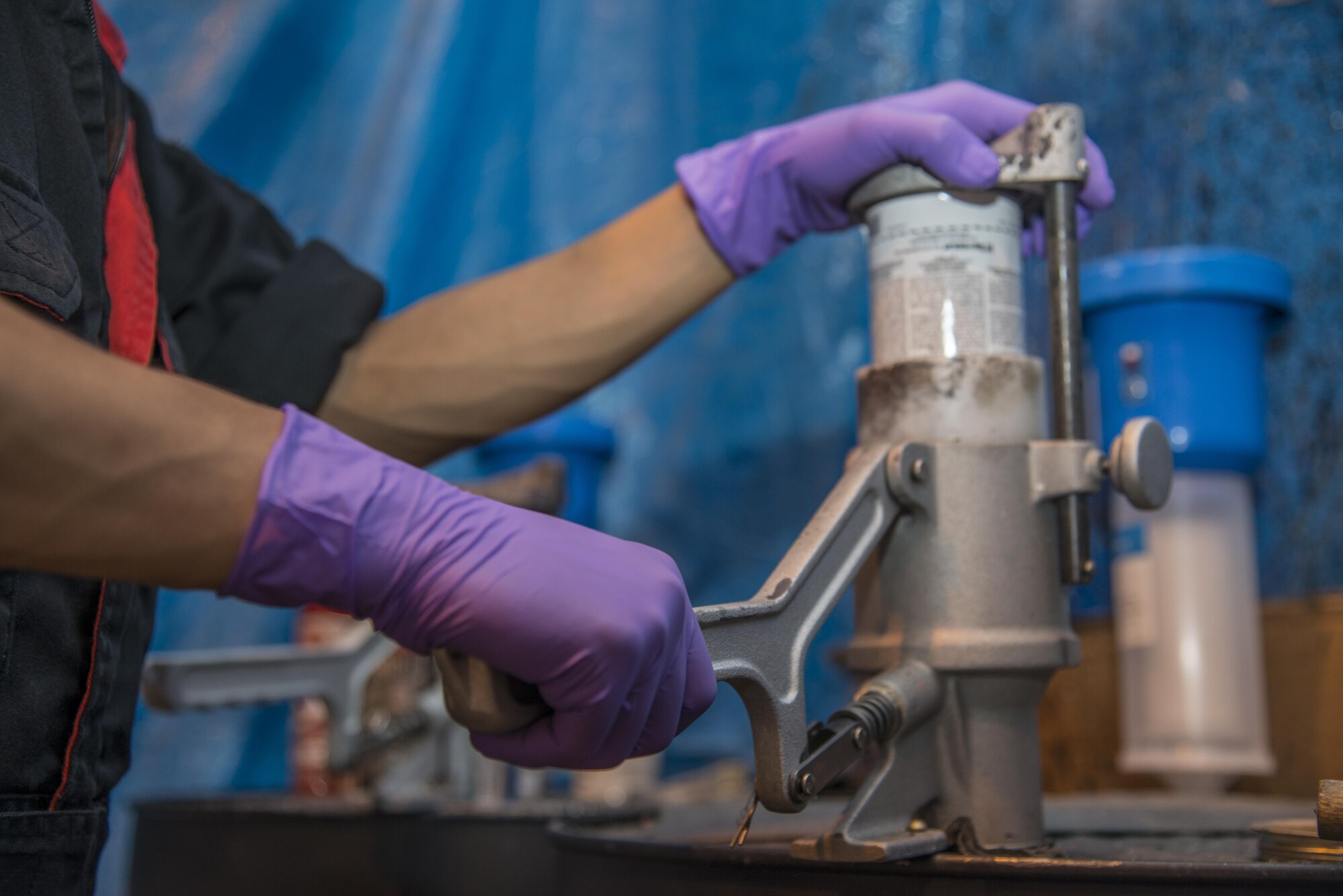 Jay Tababa, a 35th Civil Engineer Squadron hazardous waste storage area operator, punctures a spray paint can at Misawa Air Base, Japan, June 29, 2017. Tababa punctures and drains hundreds of cans annually, ensuring they’re properly disposed of in accordance with the Japanese Environmental Governing Standards. (U.S. Air Force photo by Senior Airman Brittany A. Chase)