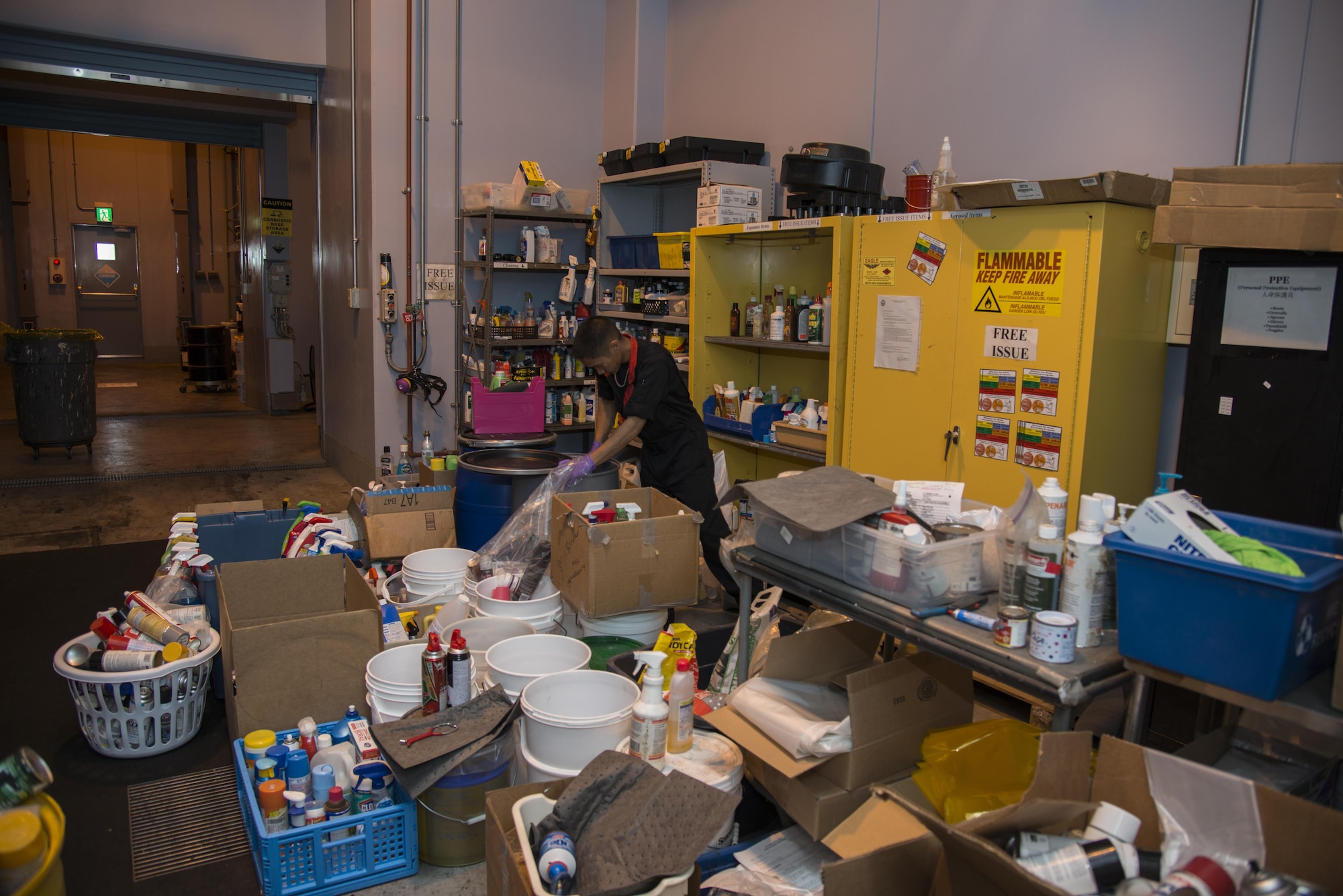 Jay Tababa, a 35th Civil Engineer Squadron hazardous waste storage area operator, sorts through house hold cleaners at Misawa Air Base, Japan, June 29, 2017. Last year alone, the hazardous waste facility disposed of more than120,000 pounds of materials, ensuring they’re properly disposed of or recycled in accordance with the Japanese Environmental Governing Standards. (U.S. Air Force photo by Senior Airman Brittany A. Chase)