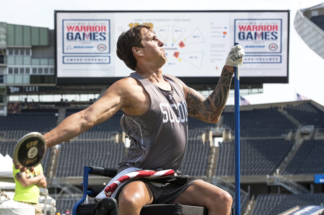 Navy Lt. Cmdr. Ramesh Haytasingh, a member of Team Special Operations Command, competes in the discus event during the 2017 Department of Defense Warrior Games in Chicago, July 3, 2017. DoD photo by Roger L. Wollenberg