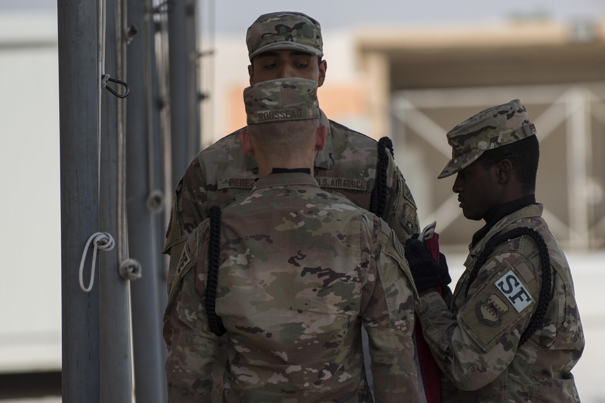 Members of the 332nd Air Expeditionary Wing honor guard fold the U.S. flag during a retreat ceremony June 30, 2017, in Southwest Asia. The ceremony was held to honor and remember service members who have made the ultimate sacrifice. (U.S. Air Force photo/Senior Airman Damon Kasberg)
