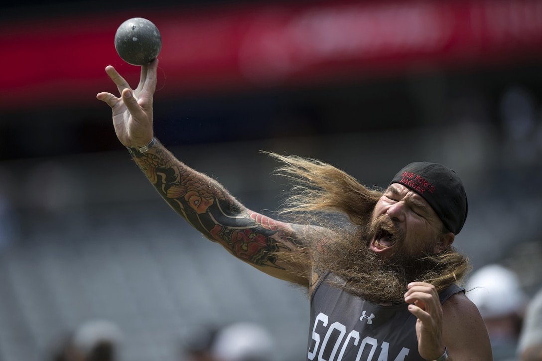 Veteran Army Staff Sgt. Ryan Murphy of Team Special Operations Command throws seated shot put during the 2017 Department of Defense Warrior Games in Chicago, July 5, 2017. DoD photo by EJ Hersom