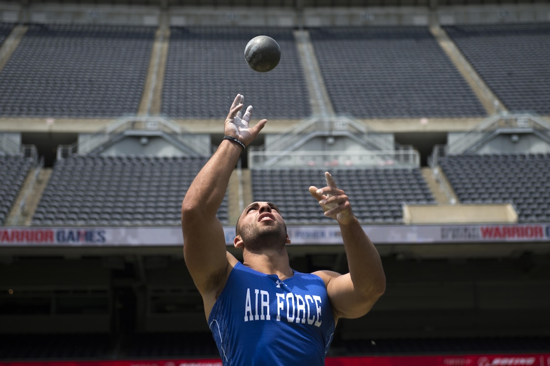 Air Force Staff Sgt. Mathew Cable tosses a shot put as part of his competition wind up at Soldier Field in the 2017 Department of Defense Warrior Games in Chicago, July 5, 2017. DoD photo by EJ Hersom