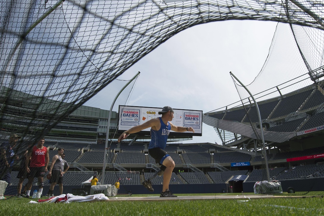 Air Force Tech Sgt. Benjamin Seekell throws discus put at Soldier Field in the 2017 Department of Defense Warrior Games in Chicago, July 5, 2017. The DoD Warrior Games are an annual event allowing wounded, ill and injured service members and veterans to compete in Paralympic-style sports. DoD photo by EJ Hersom