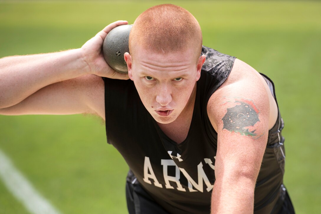 Army Spc. Mitchell Bombeck concentrates before competing in the shot put event during the 2017 Department of Defense Warrior Games in Chicago, July 3, 2017. DoD photo by Roger L. Wollenberg