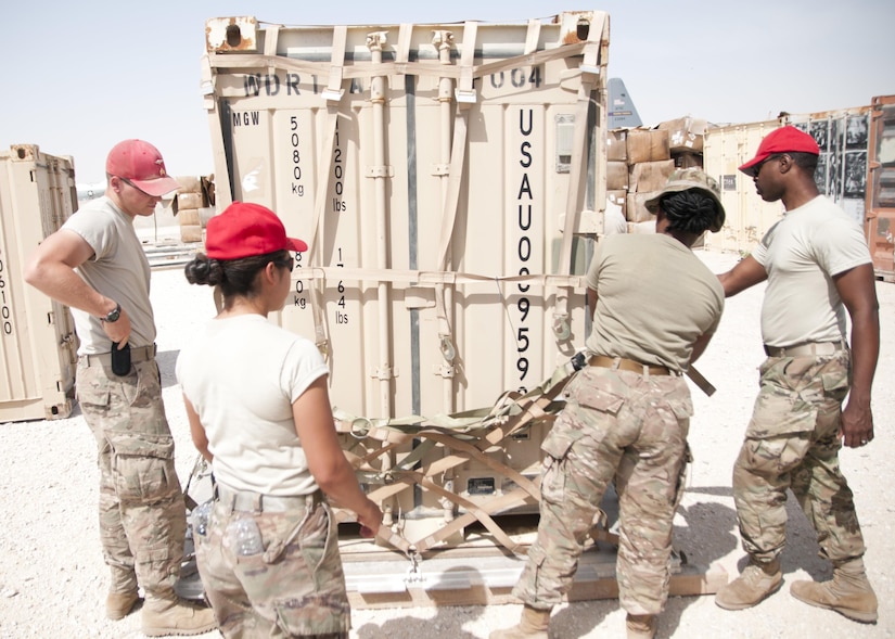 Soldiers of the 824th Quartermaster Company secure a container with cargo netting for aerial delivery at Al Udeid Air Base, Qatar on April 19, 2017. Aerial delivery operations are essential for getting supplies to troops in the Middle East when conventional means of transportation are not feasible. (U.S. Army photo by Sgt. Jeremy Bratt)