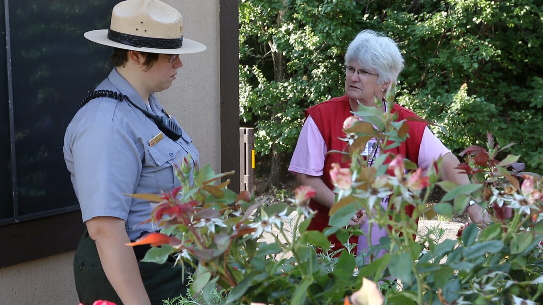 Ranger Shawna Polen (left), volunteer coordinator at Canton Lake, Oklahoma, talks to volunteer Denise Mollohan at the gate to Big Bend Campground, Canton Lake.  Mollohan has been volunteering at Canton Lake for five years with her husband Bob.