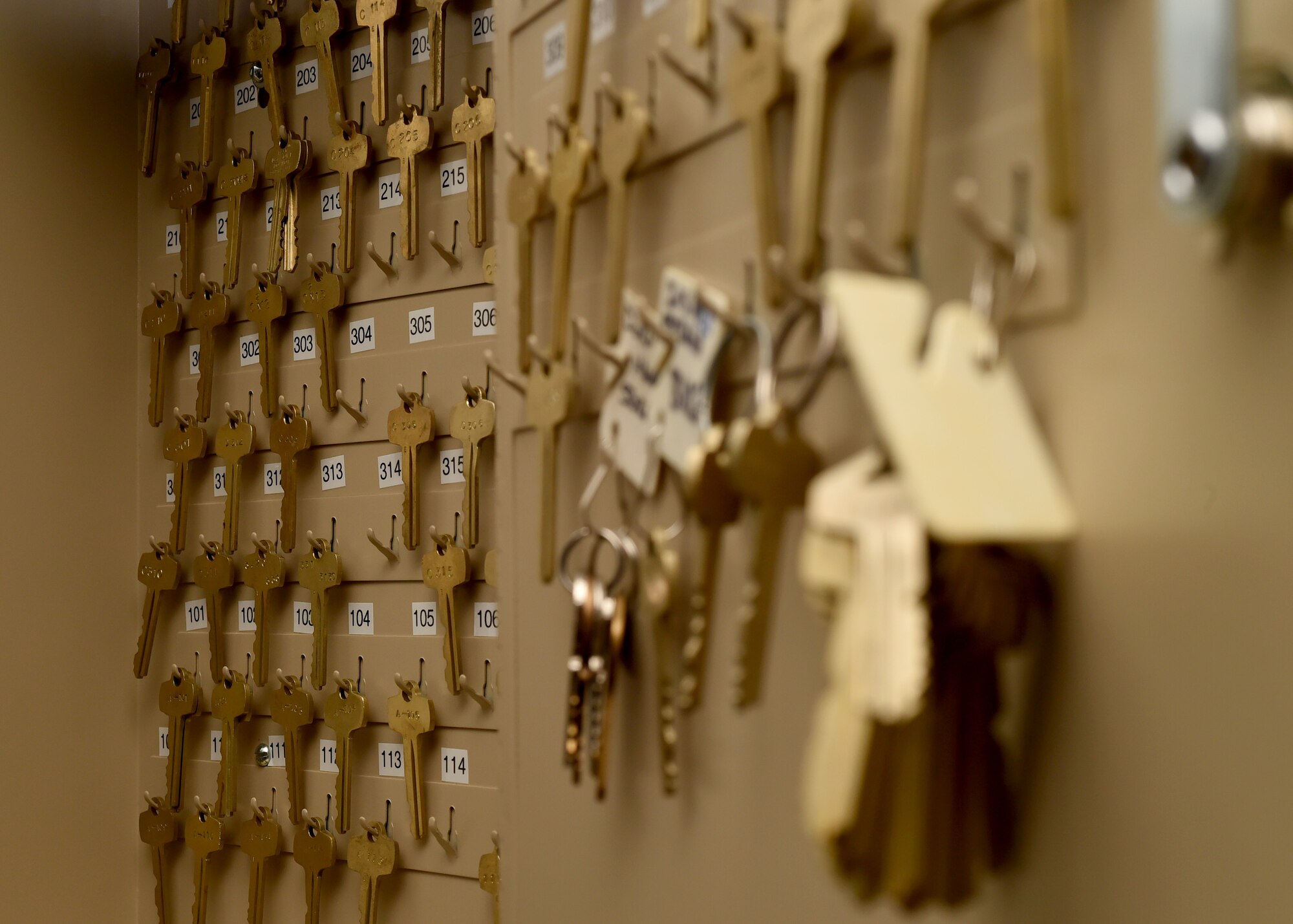 Spare keys for the Altus Air Force Base dormitory hangs in the dorm managers office, June 30, 2017, at Altus AFB, Oklahoma. Dorm management works to improve dorm quality of life for the first-term Airmen living on base by preforming multiple tasks to maintain the longevity of the Altus AFB dorms. (U.S. Air Force Photo by Airman 1st Class Jackson N. Haddon/Released).