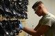 U.S. Air Force Airman Edward Smith, 20th Logistics Readiness Squadron mobility apprentice, hangs sanitized gas masks to dry at Shaw Air Force Base, S.C., June 27, 2017. Team Shaw Airmen use the masks during qualifications on weapons, such as the M4 carbine, and during deployments. (U.S. Air Force photo by Airman 1st Class Kathryn R.C. Reaves)
