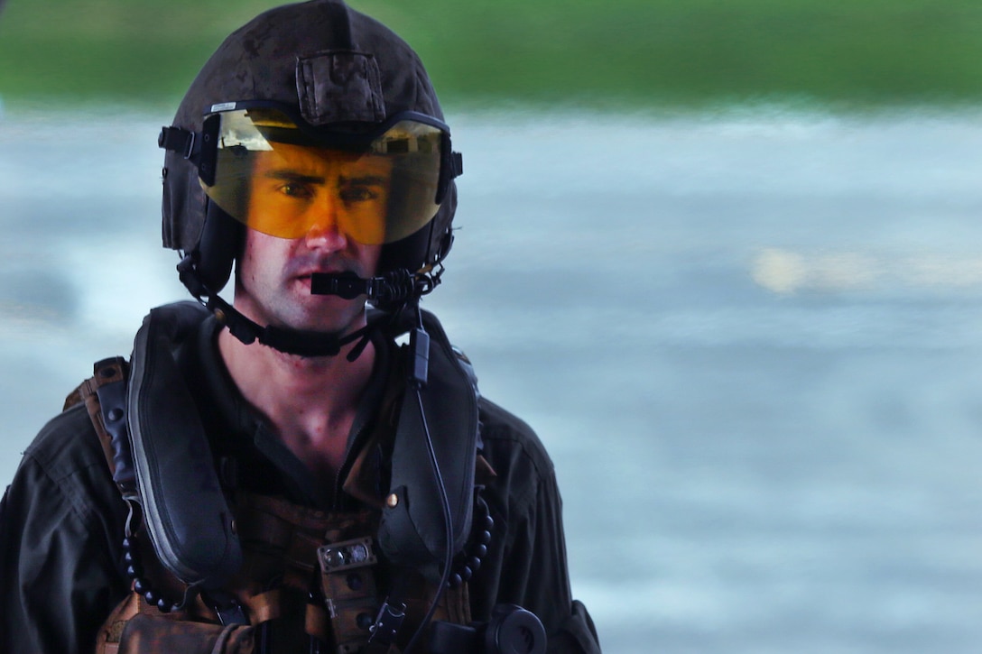 Marine Corps Sgt. Todd Gildersleeve prepares to participate in aerial gunnery training at Camp Foster, Okinawa, Japan, June 27, 2017. Gildersleeve is an aircraft avionic technician assigned to Heavy Helicopter Squadron 462, 3rd Marine Aircraft Wing, 1st Marine Aircraft Wing. Marine Corps photo by Sgt. Rebecca L. Floto