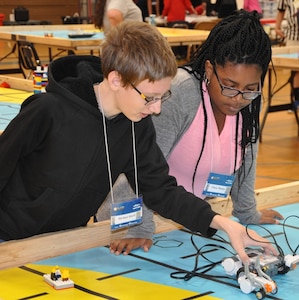 KING GEORGE. Va. (June 28, 2017) - Middle school students use remote-controlled models to solve simulated naval robotic missions at the 2017 Naval Surface Warfare Center Dahlgren Division sponsored STEM Summer Academy, held June 26-30. Camp activities included ten robotic challenges; building a water rocket and determining the optimal fuel loading to maximize height; exploring epidemiology; building and destructively testing a tower from balsa wood with the goal of maximizing the strength to weight ratio; predicting the number of each color of M&Ms in a large bag after compiling statistics on numbers in smaller bags; and building a boat out of foil and straws with the aim of maximizing its cargo carrying capacity.