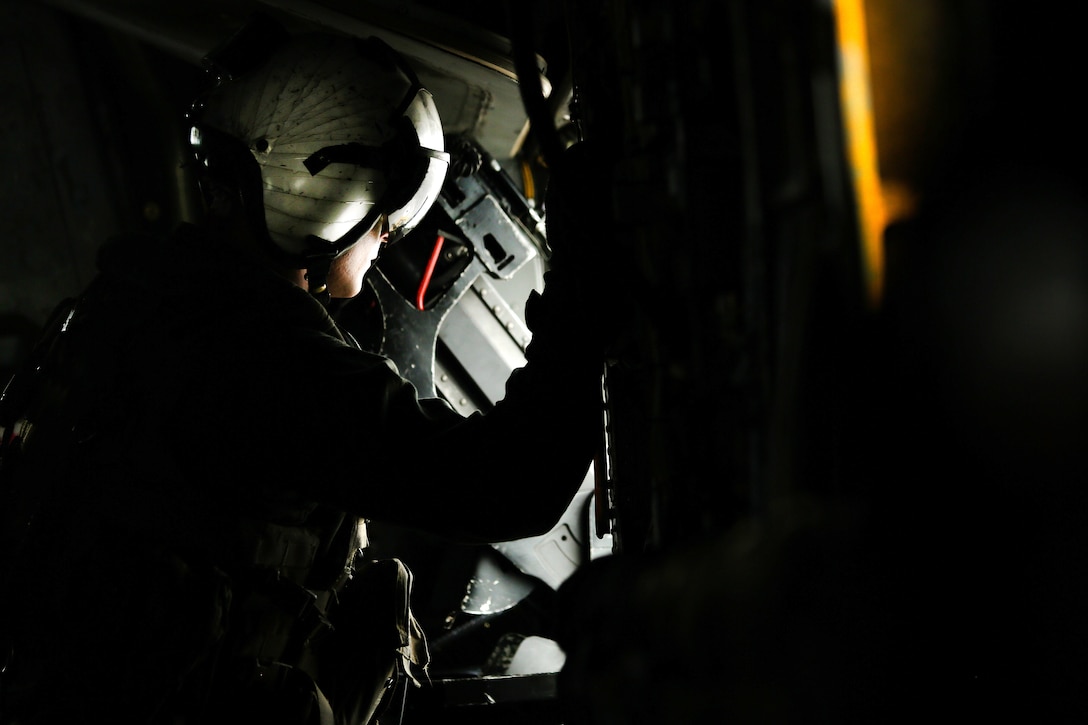 Marine Corps Cpl. Michael Rodgers prepares to participate in aerial gunnery training at Camp Foster, Okinawa, Japan, June 27, 2017. Rodgers is a crew chief assigned to Heavy Helicopter Squadron 462, 3rd Marine Aircraft Wing, 1st Marine Aircraft Wing. Marine Corps photo by Sgt. Rebecca L. Floto 