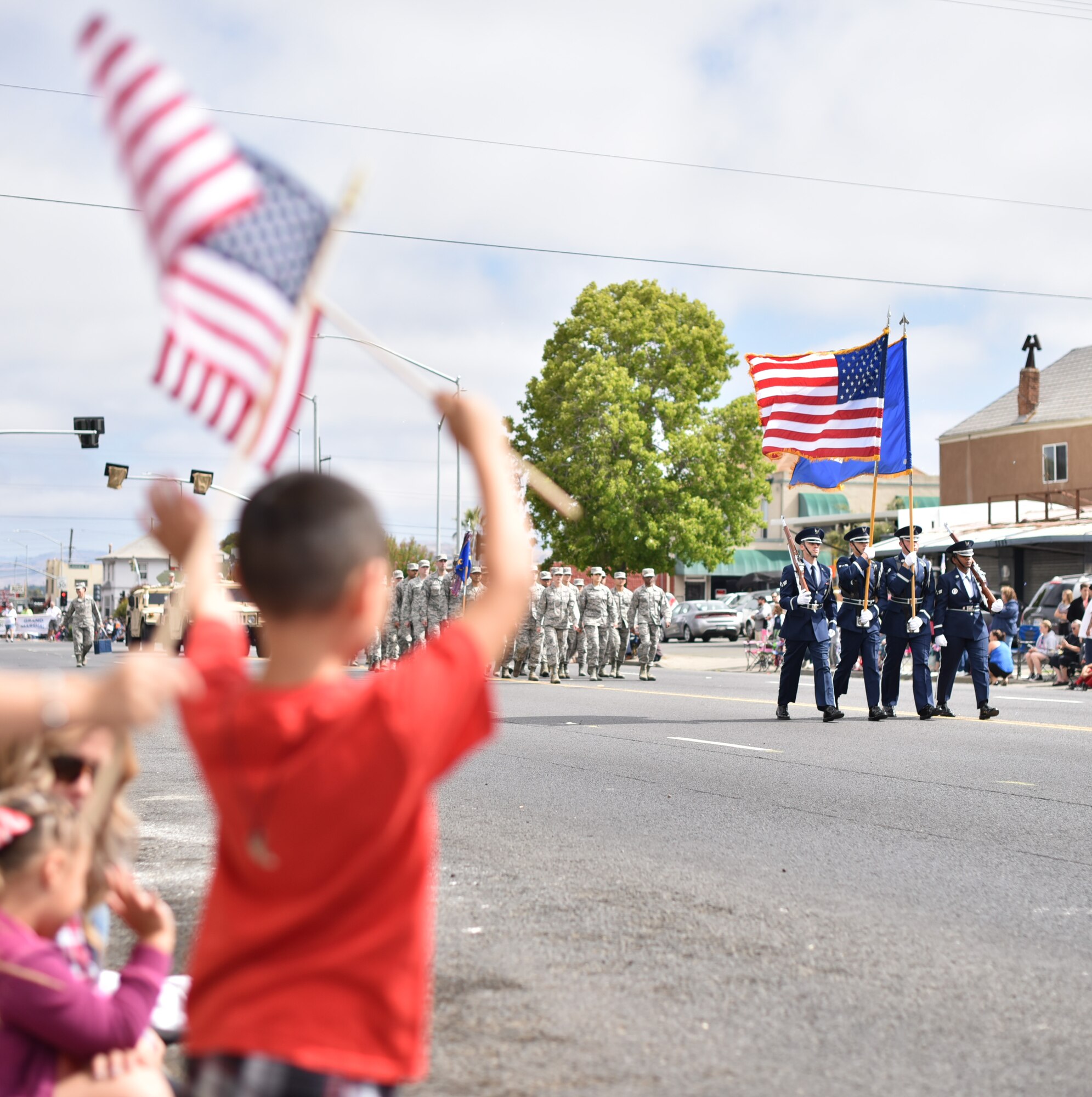 Members of the Travis Air Force Base Honor Guard march along Sonoma St. in Vallejo, Calif., during the city’s annual Independence Day Parade, July 4, 2017. About 75 Airmen from the 60th Medical Group and 821st Contingency Response Squadron also participated in the parade, with residents cheering them along a 1.5-mile path through the city. (U.S. Air Force photo by Ken Wright)