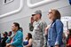 Col. John Klein, 60th Air Mobility Wing commander, and his wife Anji, pay respect to the American flag during the singing of the National Anthem during the Independence Day Parade in Vallejo, Calif., July 4, 2017. About 75 Airmen from Travis Air Force Base participated in the annual celebration, with residents cheering them along a 1.5-mile path through the city. Vallejo residents have a long history of military service, including many who have served at Travis or Mare Island Naval Shipyard, which dates back to 1854. (U.S. Air Force photo by Ken Wright)