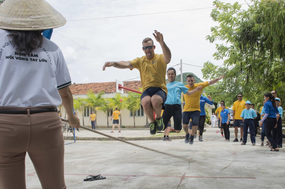 Navy sailors assigned to the littoral combat ship USS Coronado play games with residents of the Khanh Hoa Center for Social Protection during Naval Engagement Activity Vietnam 2017 in Nha Trang, Vietnam, July 6, 2017. Navy photo by Petty Officer 2nd Class Joshua Fulton
