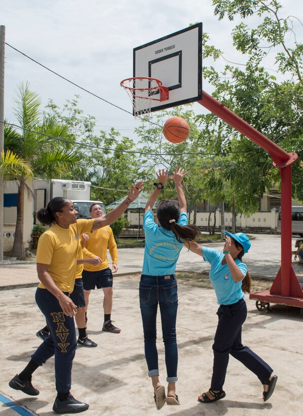 Navy sailors assigned to the littoral combat ship USS Coronado play basketball with residents of the Khanh Hoa Center for Social Protection during Naval Engagement Activity Vietnam 2017 in Nha Trang, Vietnam, July 6, 2017. Navy photo by Petty Officer 2nd Class Joshua Fulton