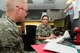 Tech. Sgt. Stacie Riley, 924th Fighter Squadron unit training manager, conducts an in-processing briefing for a new member to the unit at Davis-Monthan Air Force Base, Ariz. on June 4. Riley is one of two Airmen who is responsible for ensuring all of the enlisted personnel assigned to the unit are fully qualified to complete their mission at a moment’s notice. (U.S. Air Force photo by Tech. Sgt. Courtney Richardson)