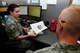 Technical Sgt. Stacie Riley, 924th Fighter Squadron unit training manager, conducts an in-processing briefing for a new member to the unit at Davis-Monthan Air Force Base, Ariz. on June 4. Riley is one of two Airmen responsible for the formal training of all enlisted personnel assigned to the unit, which is currently 150. (U.S. Air Force photo by Tech. Sgt. Courtney Richardson)