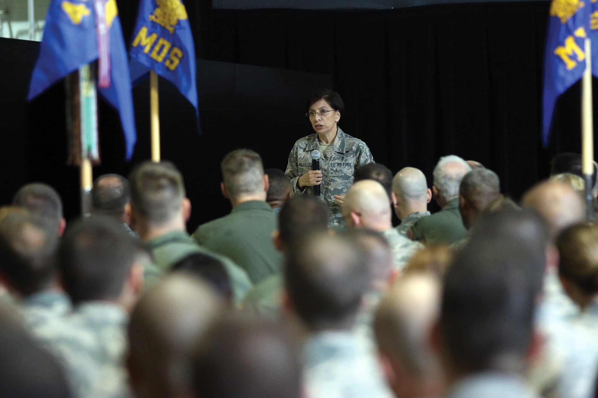 Chief Master Sgt. Ericka Kelly, Command Chief Master Sergeant, Air Force Reserve Command, speaks to the men and women of the 445th Airlift Wing during commander’s call June 4, 2017. During her visit here June 2-5, Chief Kelly observed a C-17 Globemaster III engine change, spoke to newcomers, had lunch with Airmen at the Pitsenbarger Dining Facility, met with the first sergeants and toured the facilities of the aerospace medicine squadron, aeromedical evacuation squadron Airmen and the mission support group. (U.S. Air Force photo/Tech. Sgt. Patrick O’Reilly)