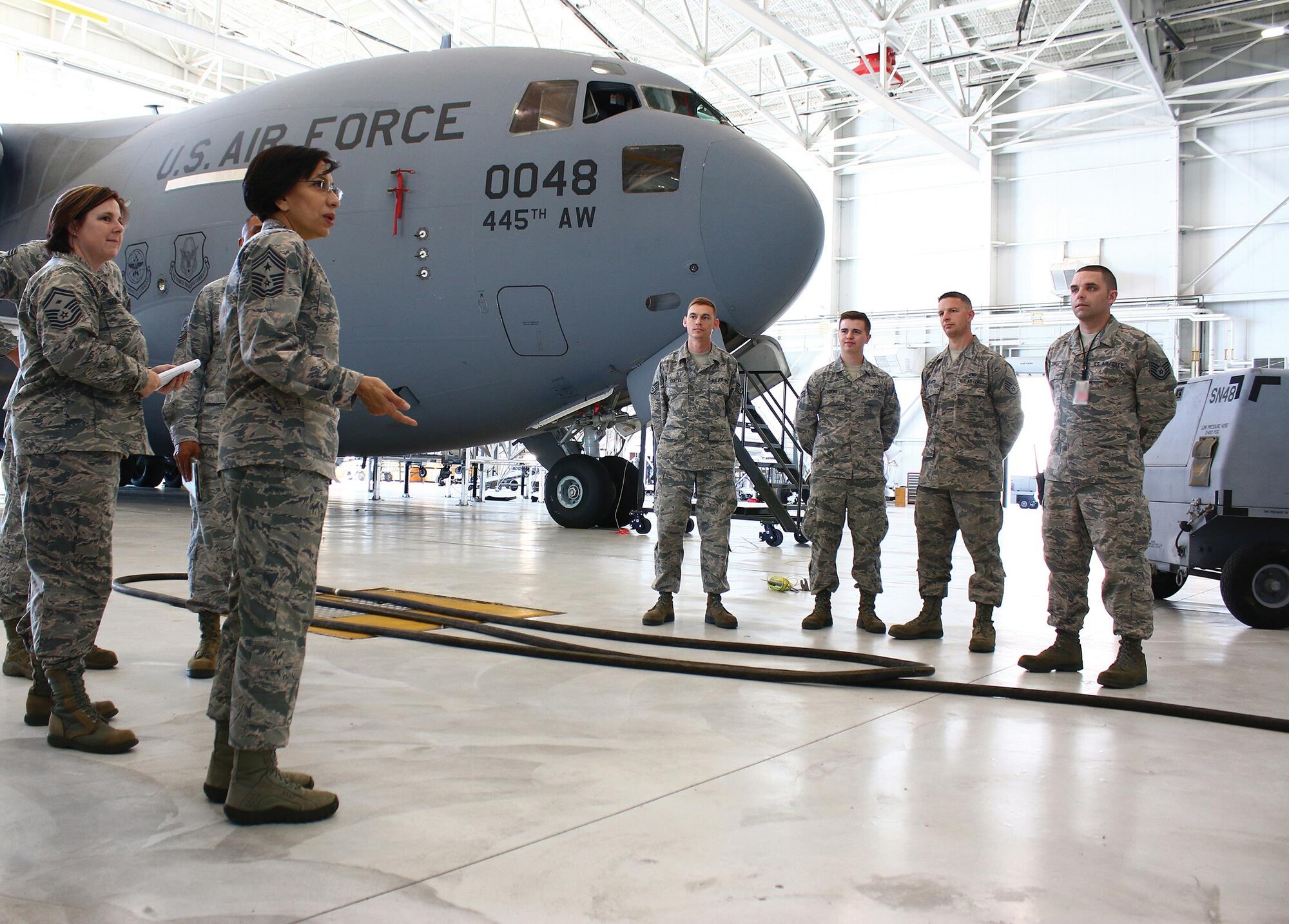 Chief Master Sgt. Ericka Kelly, Command Chief Master Sergeant, Air Force Reserve Command, speaks to maintainers from the 445th Aircraft Maintenance Squadron during her visit to the 445th Airlift Wing June 2-4, 2017. While at the wing, Chief Kelly observed a C-17 Globemaster III engine change, spoke to newcomers, had lunch with Airmen at the Pitsenbarger Dining Facility, met with the first sergeants, participated in a commander’s call with Airmen and toured the facilities of the aerospace medicine squadron, aeromedical evacuation squadron Airmen and the mission support group. (U.S. Air Force photo/Tech. Sgt. Patrick O’Reilly)