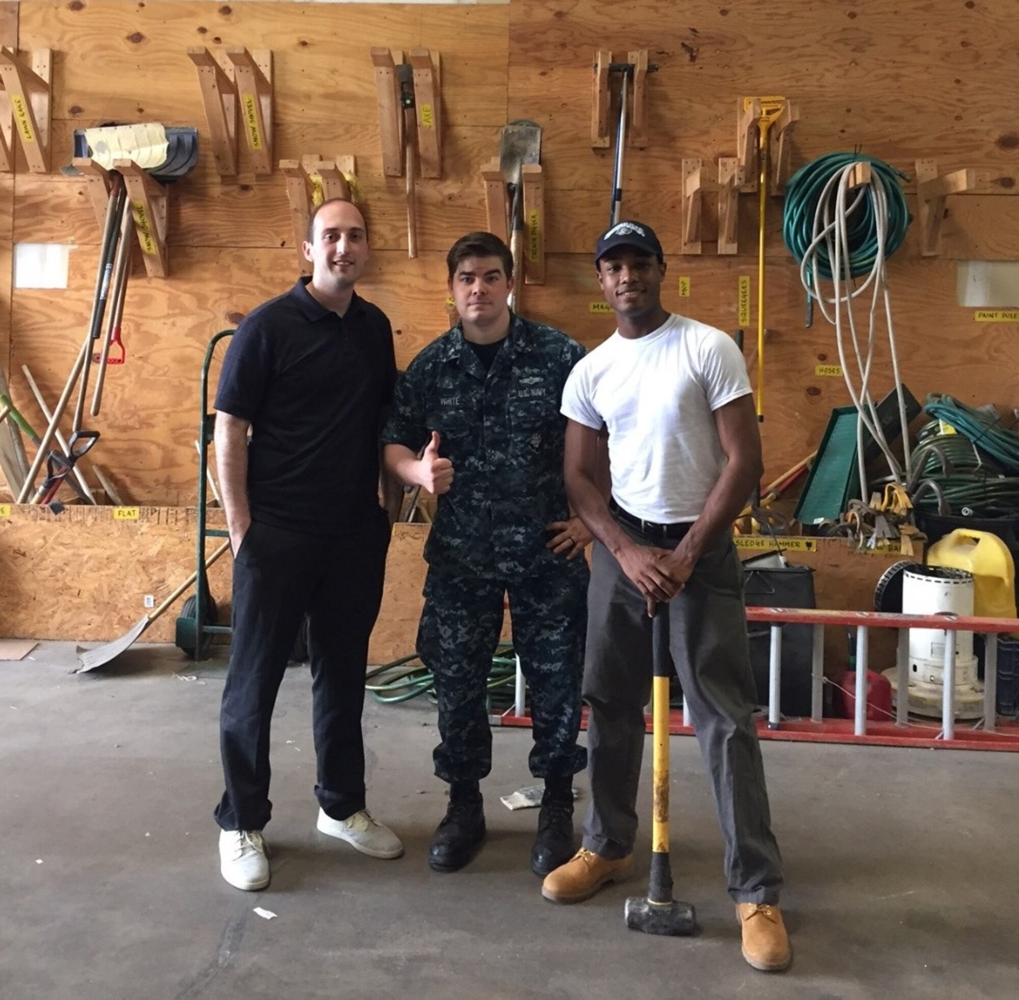 Department of Defense Cyber Crime Center member cleanup volunteers, left to right, Petty Officers 2nd Class Tyler Hupka, Brady White and Rashiem Hutchinson at the ReStore, a non-prifit home improvement store to benefit Habitat for Humanity June 16, 2017. (Photo/Tech Sgt. Hannah Cardenas)   