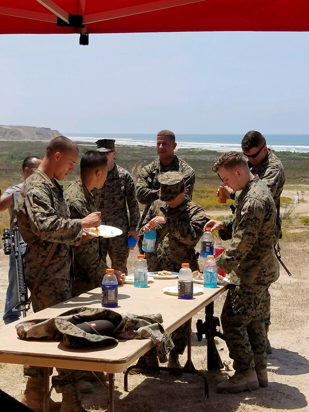 Marines of Contingency Support Company celebrate Independence day in the field with burgers and hot dogs grilled by senior Company leadership. 