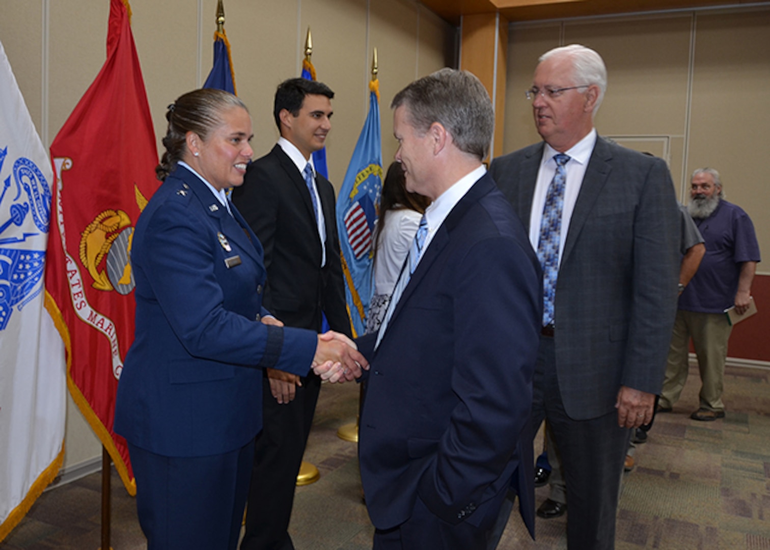 Air Force Brig. Gen. Linda Hurry shakes hands with David Gibson, Defense Logistics Agency Installation Support at Richmond site director, in her reception line after she assumed command of Defense Logistics Agency Aviation June 28, 2017 during a change of command ceremony on Defense Supply Center Richmond, Virginia.  