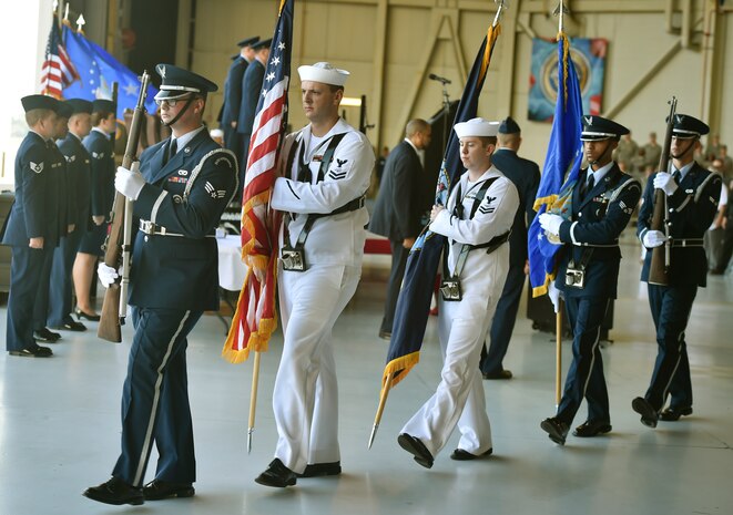Airmen and Sailors post the colors during the 628th Air Base Wing and Joint Base Charleston change of command ceremony at Nose Dock 2 here, July 6, 2017. Col. Jeffrey Nelson took command from Col. Robert Lyman during the ceremony. U.S. Air Force Maj. Gen. Christopher Bence, U.S. Air Force Expeditionary Center commander, presided over the event.