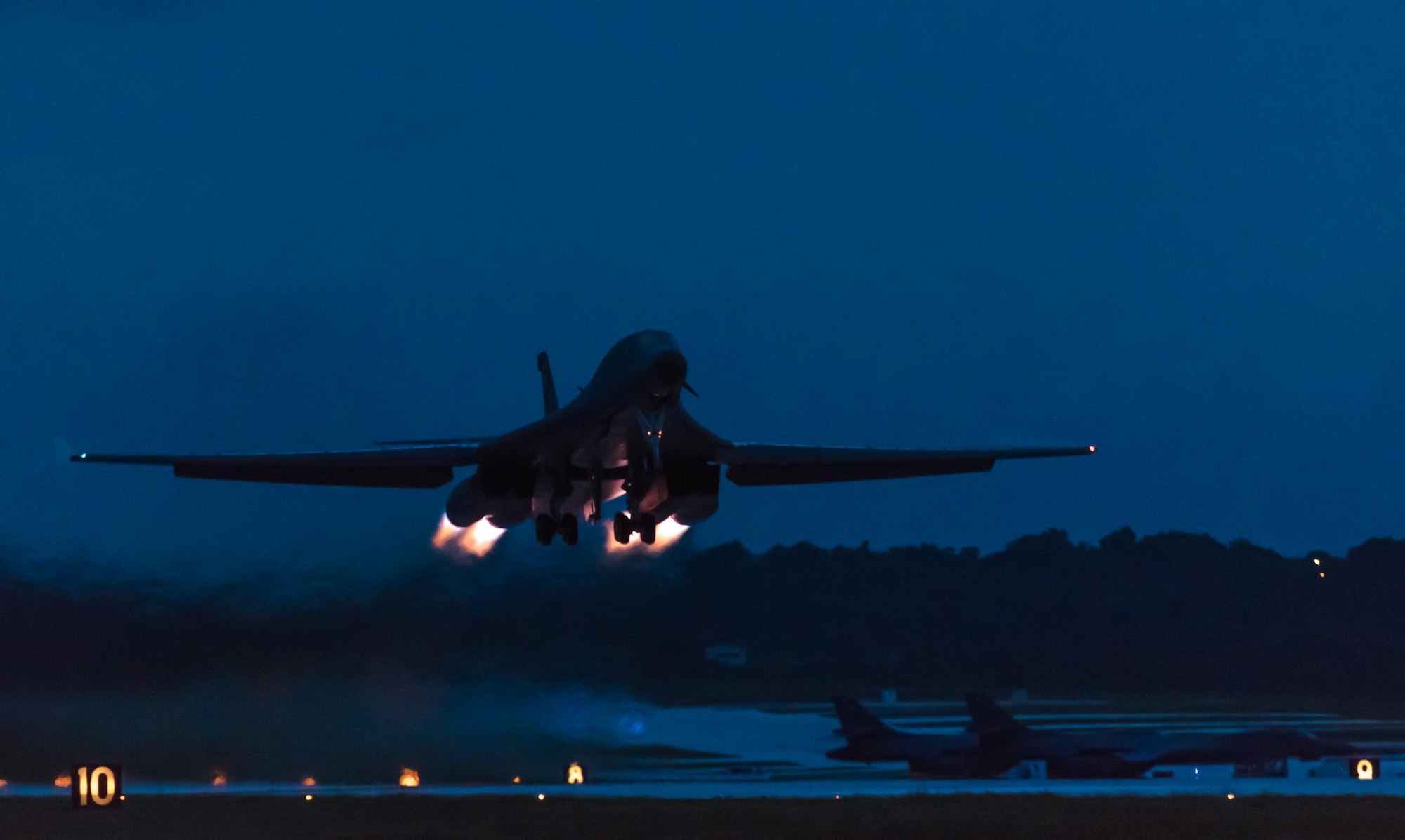 A U.S. Air Force B-1B Lancer assigned to the 9th Expeditionary Bomb Squadron, deployed from Dyess Air Force Base, Texas, takes off from Andersen Air Force Base, Guam to fly a bilateral mission with two Japan Air Self-Defense Force F-15’s over the East China Sea, July 6, 2017. This mission marks the first time U.S. Pacific Command B-1B Lancers have conducted combined training with JASDF fighters at night, demonstrating our increasing combined capabilities. (U.S. Air Force photo by Airman 1st Class Jacob Skovo)