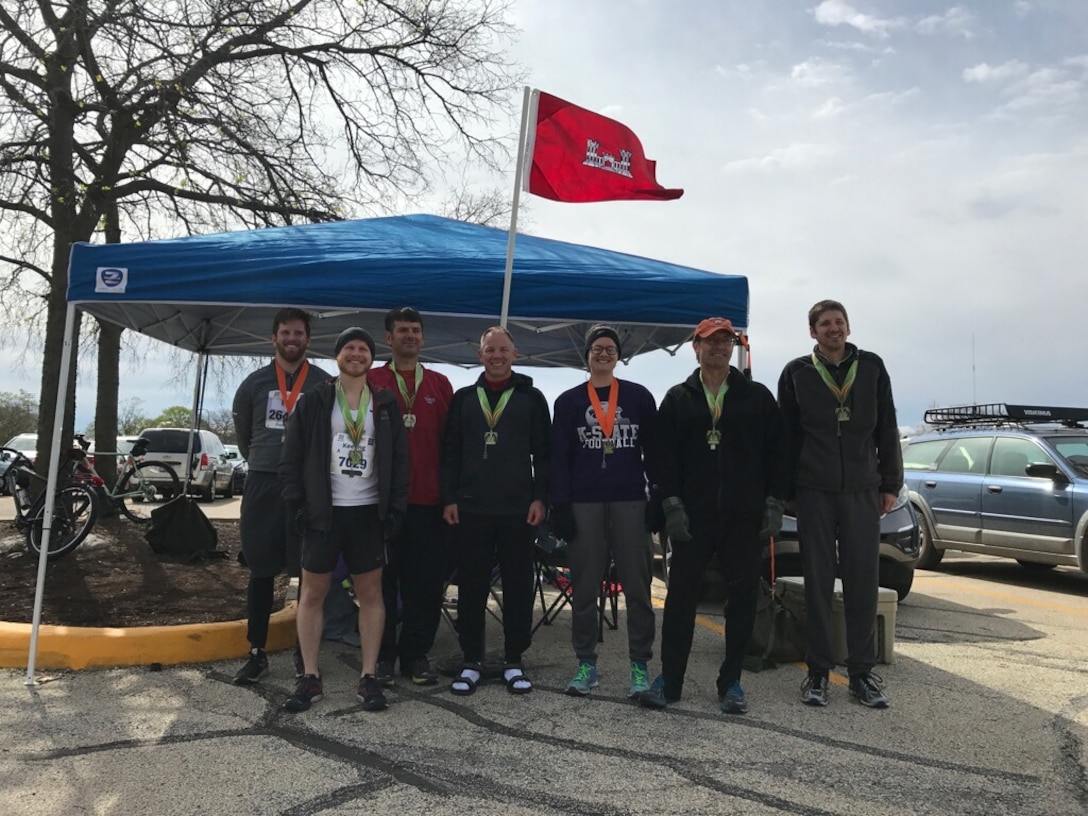 Runners from the Construction Engineering Research Laboratory after completing in the Ninth Illinois Marathon.  Eric Kreiger, Ryan Keeling, George Calfas, Jeff Burkhalter, Elle Williams, Garth Anderson and Max Foltz.