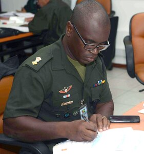 Lt. Col. Lloyd Souvenir, Guyana Defense Force, participates in a natural disaster training exercise June 21 at the Chilean Army Military Academy in Santiago, Chile. Over 100 people from 20 partner nation Armies, Defense Forces and civil and non-governmental agencies are participating in the week-long Conference of American Armies-sponsored event focusing on integration. 