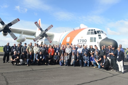 Members of the Pacific Search and Rescue Steering Committee stand with the U.S. Coast Guard HC-130 Hercules airplane in Auckland, New Zealand May 23, 2017. The committee is working to build SAR capability and cooperation across the Pacific to work together seamlessly to save lives.