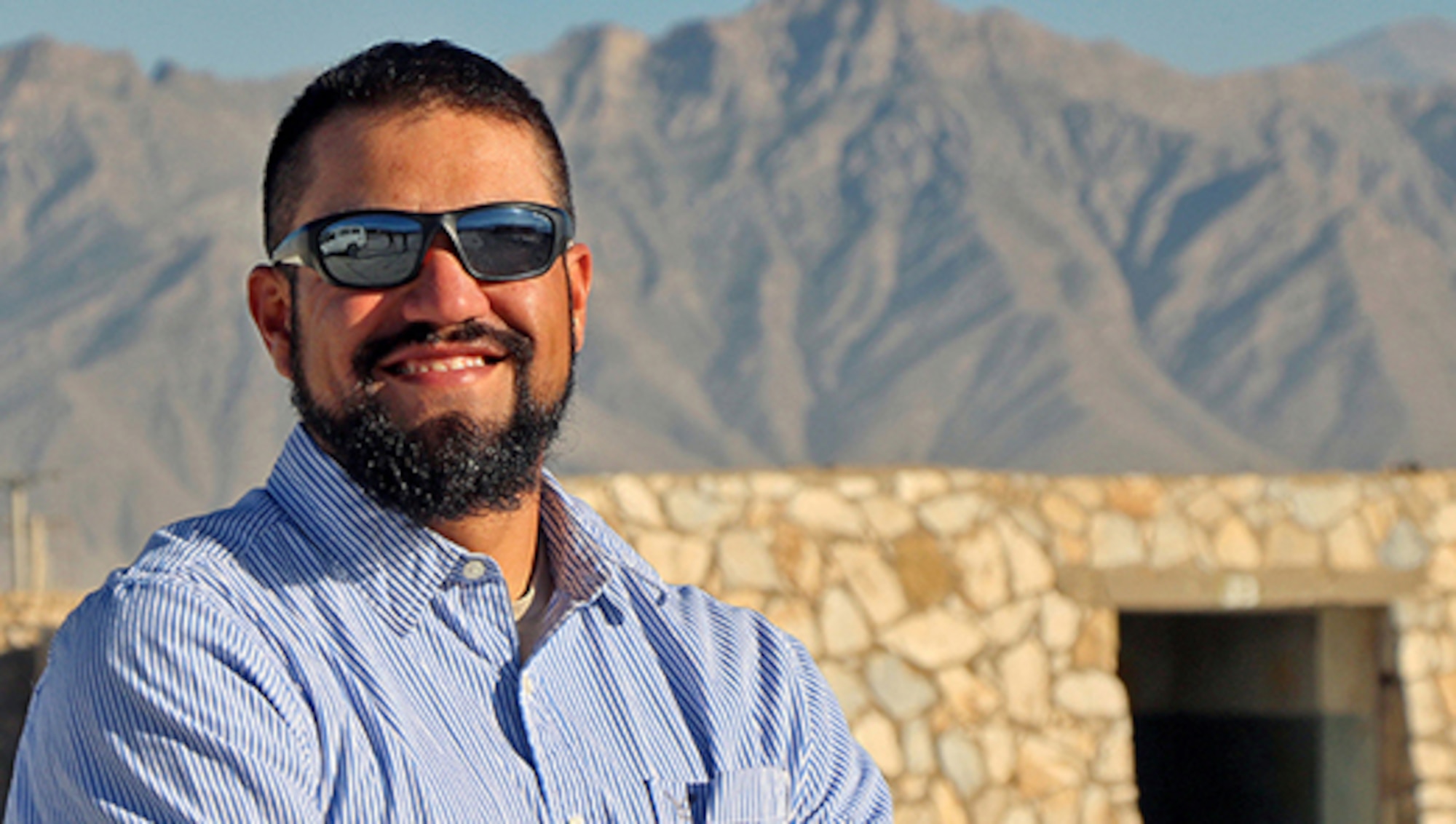 Jason Montano, an industrial workload specialist at Robins Air Force Base, Ga., is currently serving a one-year tour at Bagram Airfield, Afghanistan. At any one time, there are about 150 Air Force civilians deployed at various locations around the world. (U.S. Air Force Photo/Jathzed Fabara)