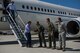 U.S. Air Force Col. John Klein, 60th Air Mobility Wing commander, third from right, Col. Adrian White, 349th Air Mobility Wing vice commander, second from right, and Col. Joel Safranek, 621st Contingency Response Wing vice commander greet members of a congressional delegation upon their arrival to Travis Air Force Base, Calif., June 30, 2017. The CODEL stopped at Travis and received a tour of a KC-10 Extender before heading on an overseas trip. The KC-10 is an Air Mobility Command advanced tanker and cargo aircraft designed to provide increased global mobility for U.S. armed forces. (U.S. Air Force photo by Master Sgt. Joseph Swafford)