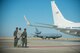 U.S. Air Force Col. John Klein, 60th Air Mobility Wing commander, right, Col. Joel Safranek, center, 621st Contingency Response Wing vice commander and Col. Adrian White, 349th Air Mobility Wing vice commander wait on the flight line as a plane carrying a congressional delegation taxis to depart Travis Air Force Base, Calif., June 30, 2017. The CODEL stopped at Travis and received a tour of a KC-10 Extender before heading on an overseas trip. The KC-10 is an Air Mobility Command advanced tanker and cargo aircraft designed to provide increased global mobility for U.S. armed forces. (U.S. Air Force photo by Master Sgt. Joseph Swafford)