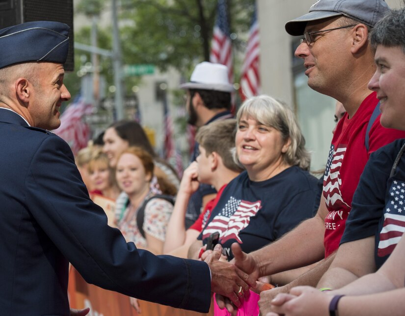 Col. E. John Teichert, 11th Wing and Joint Base Andrews commander, greets an audience member at a Today Show taping near Rockefeller Plaza in New York City, July 4, 2017. Teichert was there in support of his Airmen with the U.S. Air Force Band ceremonial brass ensemble and Honor Guard color team participating in Independence Day celebrations in New York. (US Air Force Photo by Airman 1st Class Gabrielle Spalding)