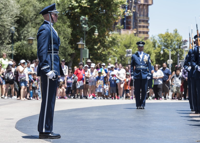 Capt. Riley Platt, U.S. Air Force Honor Guard Drill Team commander, directs his Airmen at Disney’s California Adventure Park in Anaheim, Calif., June 28, 2017. In order to perform across the country and with collective accuracy, the team practiced the routine approximately six times together before leaving Joint Base Anacostia-Bolling, District of Colombia, and prior to the start of each performance day on the trip. (U.S. Air Force photo by Senior Airman Jordyn Fetter)