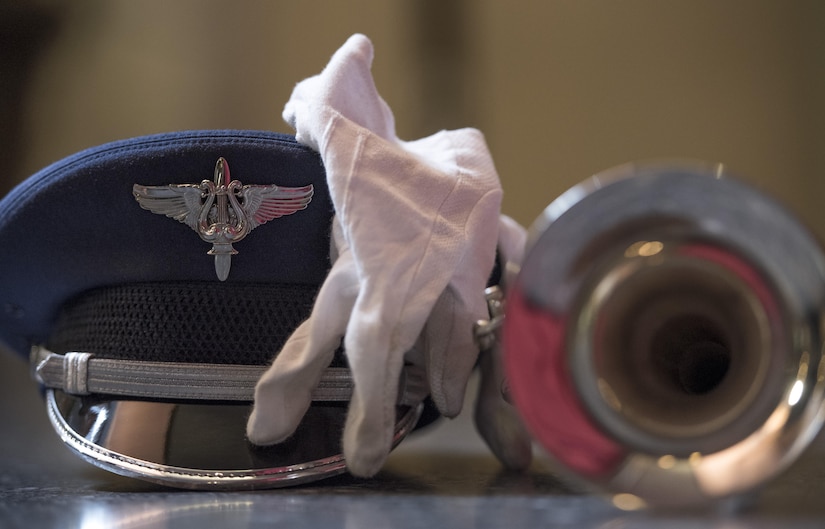 A U.S. Air Force band member's hat, glove and trumpet rest on the floor near Rockefeller Plaza in New York City, July 4, 2017. The U.S. Air Force Band ceremonial brass ensemble and an Honor Guard color team were there to represent the men and women of the U.S. Air Force during a taping of the Today Show and opening ceremonies at Yankee Stadium for a Yankees baseball game. (US Air Force Photo by Airman 1st Class Gabrielle Spalding)