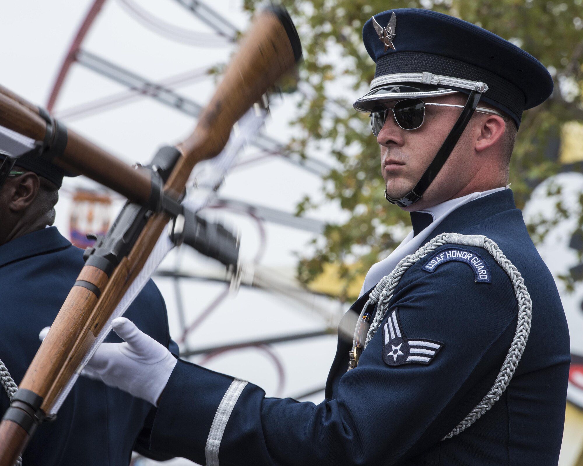Senior Airman Rigby Carter, U.S. Air Force Honor Guard Drill Team ceremonial guardsman, performs a rifle maneuver at Disney’s California Adventure Park in Anaheim, Calif., July 1, 2017. The team develops new performances every year at Keesler Air Force Base, Miss., then proceeds to share it with the world during various outreach events until the next year. (U.S. Air Force photo by Senior Airman Jordyn Fetter)
