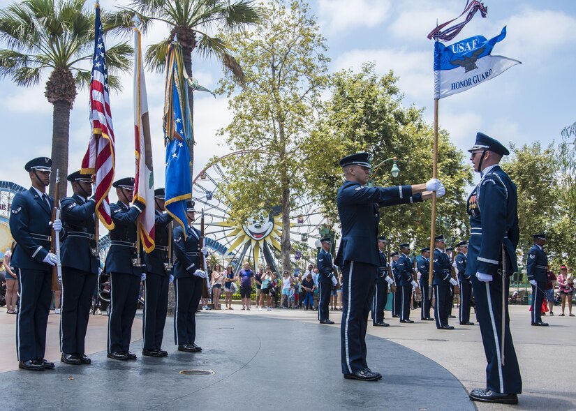 The U.S. Air Force Honor Guard enters a performance area at Disney’s California Adventure Park in Anaheim, Calif., July 1, 2017. In order to perform across the country with collective accuracy, the team practiced the routine approximately six times together before leaving Joint Base Anacostia-Bolling, District of Columbia, and prior to the start of each performance day on the trip. (U.S. Air Force photo by Senior Airman Jordyn Fetter)
