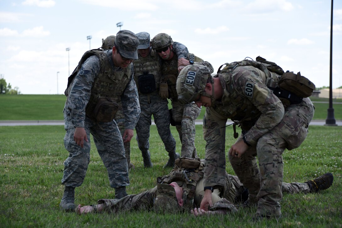 Airmen assigned to the 22nd Civil Engineer Squadron practice buddy-carry scenarios, June 26, 2017, at McConnell Air Force Base, Kan. The Airmen practiced several different carries to increase their ability to react quickly in a combat situation as part of Tactical Casualty Care training. (U.S. Air Force photo/Airman 1st Class Alan Ricker)