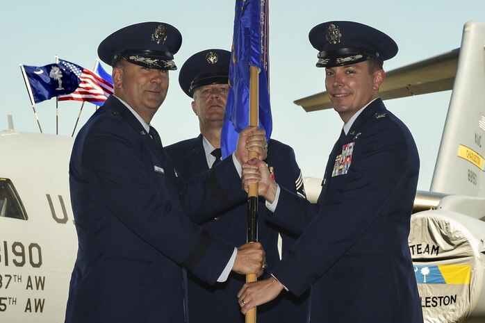 Col. Jeffrey Nelson, right, incoming 628th Air Base Wing and Joint Base Charleston commander, assumed command from Maj. Gen. Christopher Bence, left, U.S. Air Force Expeditionary Center commander, at Nose Dock 2 here, July 6. Nelson accepted command from Col. Robert Lyman, outgoing 628th ABW and Joint Base Charleston commander.