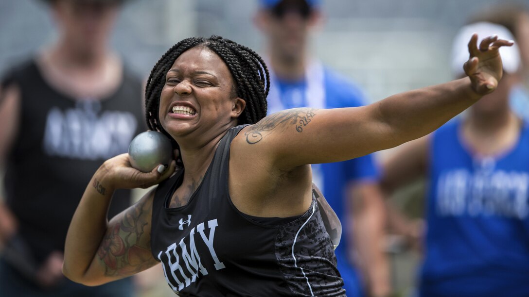 Army Spc. Stephanie Morris throws a seated shot put during the 2017 Department of Defense Warrior Games in Chicago, July 5, 2017. The annual event allowing wounded, ill and injured service members and veterans to compete in Paralympic-style sports. DoD photo by EJ Hersom