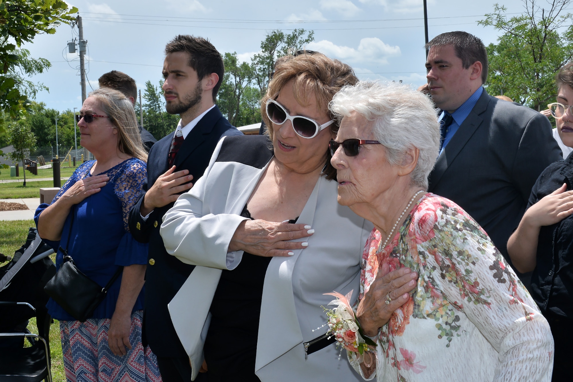 Penni Tennant-Schumacher, left, talks to her mother, Margaret Tennant, wife of retired Chief Master Sgt. Thomas H. Tennant, during the dedication ceremony of Tennant Hall on June 30. Tennant played a major role establishing intelligence, surveillance and reconnaissance operations in multiple units which later became the 97th IS. (U.S. Air Force photo by Charles Haymond)